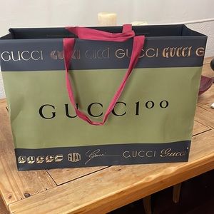 Large Gucci 100 shopping bag.